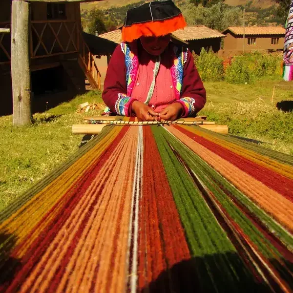 Andean women weaving traditional textiles in Cusco highlands