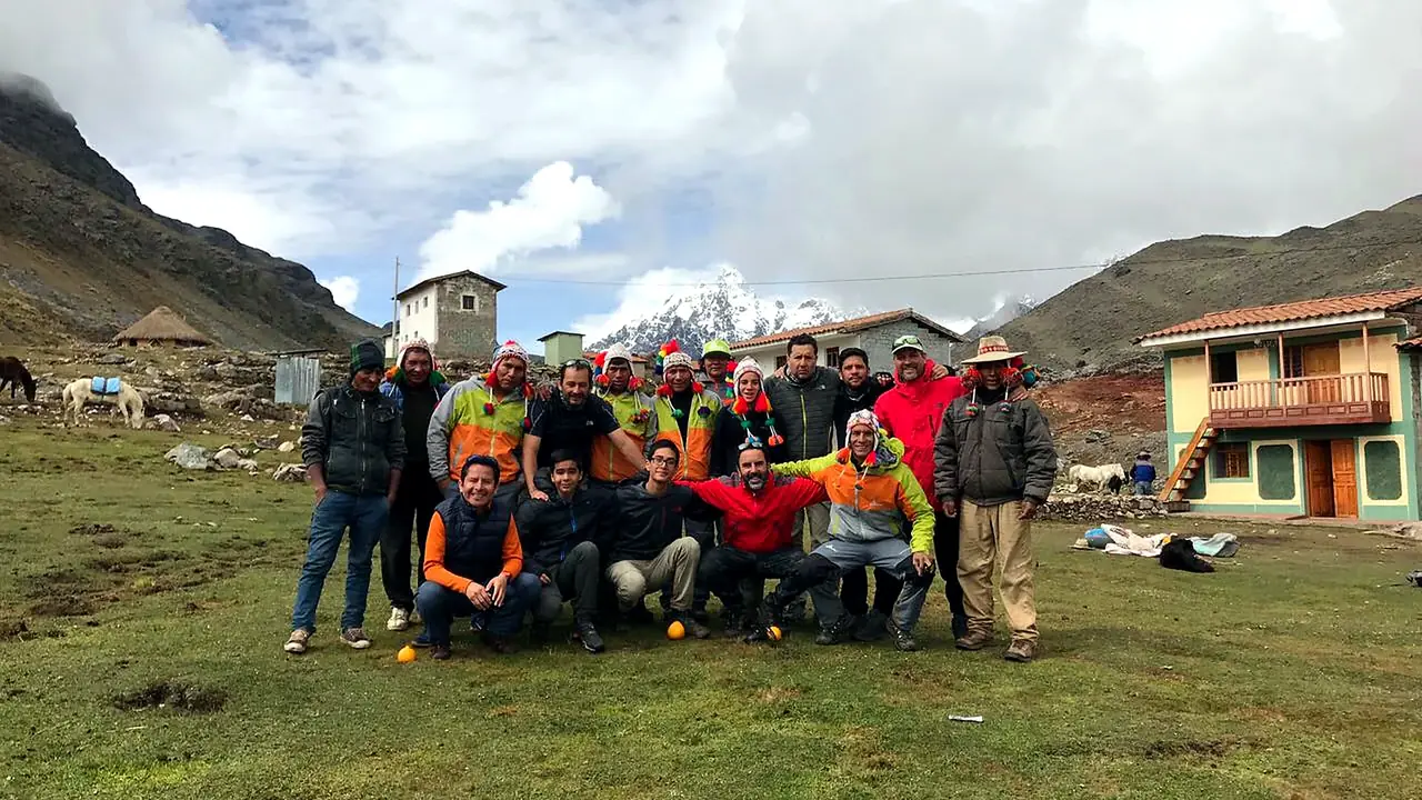 Santu team with local community members in a highland village on the Ausangate trek